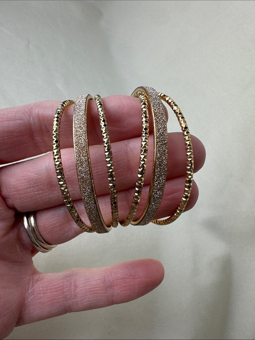 Bundle of Sparkly Multi-Tone Hoop Earrings in Gold, Silver, and Black - Picture 2 of 8